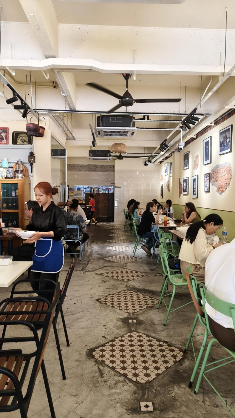 Inside Din Sun Kopitiam, long room with tile floor